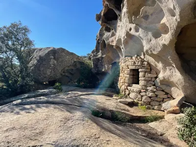 a photographer taking a picture of a rock wall at Villa proche plage extrême sud Corse in Monacia-dʼAullène