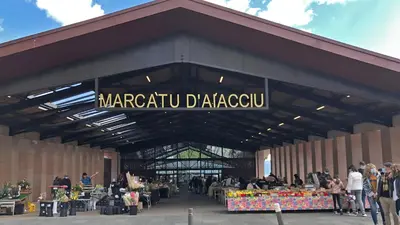 a market in a building with a sign on it at Studio cosy en centre d'Ajaccio in Ajaccio