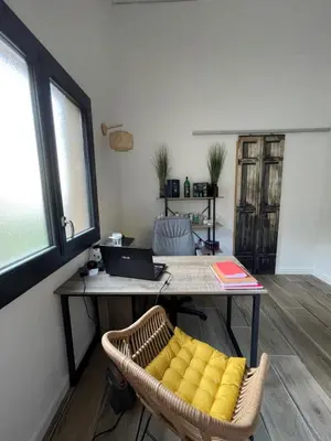 an office with a desk with a laptop and a chair at Carpediem corsica adult only in Poggio-dʼOletta