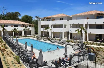 a view of the pool at the resort at Superbe appartement vue mer terrasse couverte face à la mer in Linguizzetta