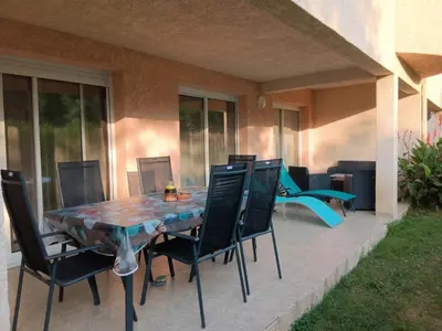 a table and chairs sitting on a patio at Chez Laurence et Fabien in Santa-Maria-Poggio