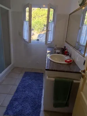 a bathroom with a sink and a mirror at villa marina in Sartène