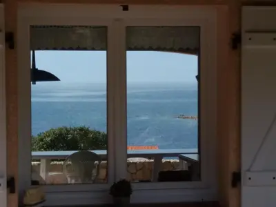 a window with a view of the ocean at villa marina in Sartène