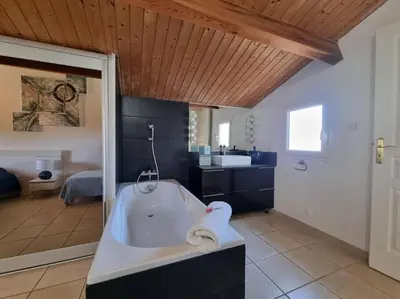 a large bathroom with a tub and a sink at Luxury Villa with Stunning Panoramic Views in Grosseto-Prugna