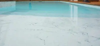 a swimming pool with blue and white marble floors at A Dimora di Murza Liliekaena in Albitreccia