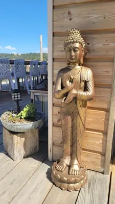 a statue of a woman standing on a deck at A Dimora di Murza Liliekaena in Albitreccia