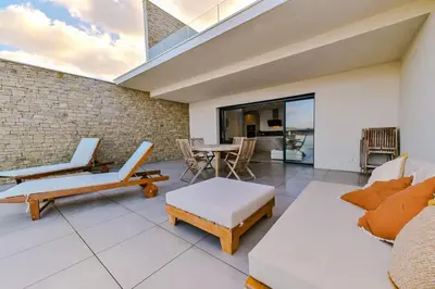 a living room with a couch and a table at Le Galatée, T3 luxe in Porticcio