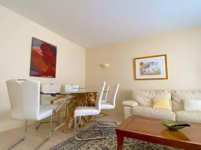 a living room with a couch and a table at T3 Ajaccio Sacrée Coeur in Ajaccio