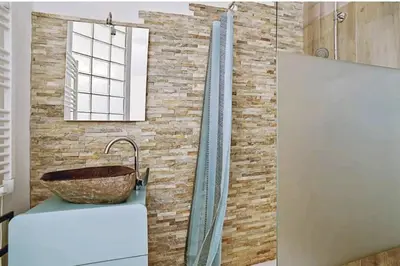 a bathroom with a sink and a window and a tub at Appartement Roi Jérôme - Hypercentre in Ajaccio