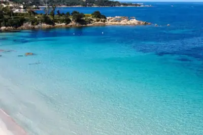 a view of a beach with blue water at Porticcio- Duplex dans propriété privée in Cauro