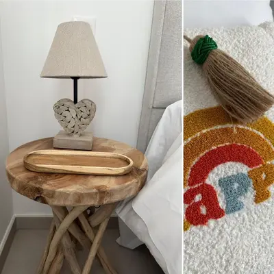 a table with a lamp on it next to a bed at T4 Cala Rossa - 3 Ch - Piscine et Plage à pied in Lecci