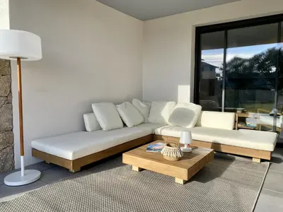 a living room with a couch and a coffee table at Domaine d'Arca - Flaubert 06 - 6 pers in Porto-Vecchio