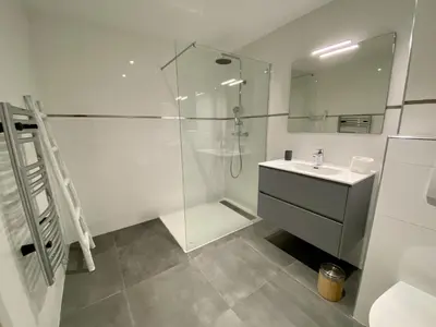 a white bathroom with a shower and a sink at Domaine d'Arca - Flaubert 06 - 6 pers in Porto-Vecchio