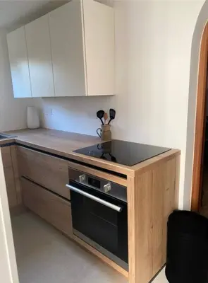 a kitchen with a stove and a counter top at Maison à 150m de la plage naturiste, 2 chambres in Linguizzetta