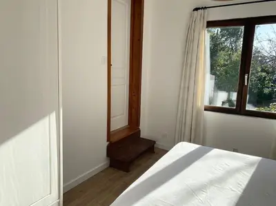 a bedroom with a bed and a window at Maison à 150m de la plage naturiste, 2 chambres in Linguizzetta