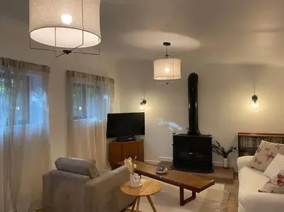 a living room with a couch and a fireplace at Maison à 150m de la plage naturiste, 2 chambres in Linguizzetta