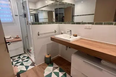 a bathroom with a sink and a mirror at Villa A Liccia piscine 4pers proche Ville et Port in Porto-Vecchio