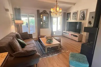 a living room with a couch and a coffee table at Villa A Liccia piscine 4pers proche Ville et Port in Porto-Vecchio