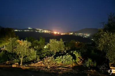 a view of a garden at night with lights at Meublés de Tourisme Casa Erbaggio in Sartène
