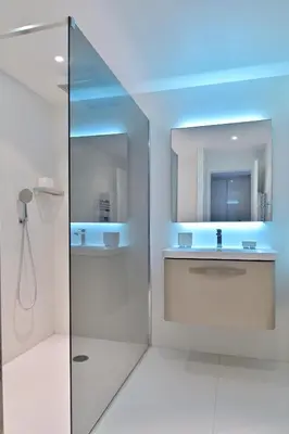 a bathroom with a sink and a mirror at VILLA DOLCE VITA in Ajaccio