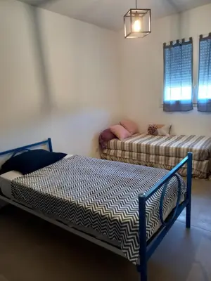a bedroom with two beds in a room at Casa di l Alivetu in Ventiseri