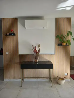 a room with a table with plants on a wall at Casa di l Alivetu in Ventiseri