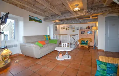 a living room with a couch and a table at 3 Bedroom Stunning Home In Marignana in Marignana