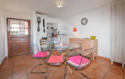 a dining room with a glass table and chairs at 3 Bedroom Stunning Home In Marignana in Marignana