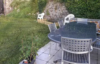 a table and chairs sitting on a patio at 3 Bedroom Stunning Home In Marignana in Marignana