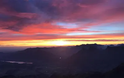 a sunset over a mountain range with the sun setting at 3 Bedroom Stunning Home In Marignana in Marignana