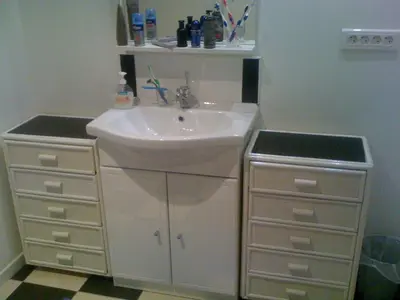 a white bathroom with a sink and a dresser at maison T3 500m de la plage in Poggio-Mezzana