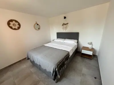 a bathroom with a shower and a toilet and a sink at Mini Villa 4-6 pers. Les hameaux de Saint Cyprien in Lecci