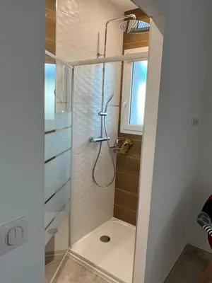 a shower with a glass door in a bathroom at Villa pedicervu haut in Ventiseri