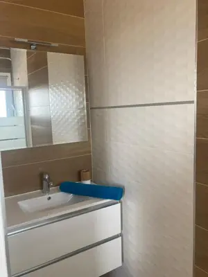 a bathroom with a sink and a mirror at Villa pedicervu haut in Ventiseri