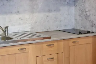 a kitchen with a sink and a counter top at Casa Johanna, plage et piscine in Moriani Plage