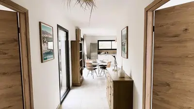 a hallway of a home with a dining room at Villa Copains, 5 pers, piscine chauffée, 5 mn plage in Cirendinu