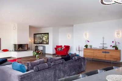 a living room with a couch and a fireplace at Villa HAPPY DAYS in Pietrosella