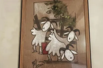a picture of three sheep in a picture frame at Appartement prestige, cour Paoli in Corte