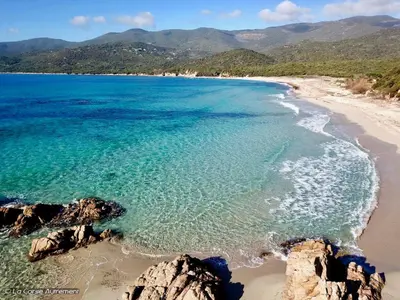an aerial view of a beach with rocks and the ocean at Le Francorsicat in Serra-di-Ferro