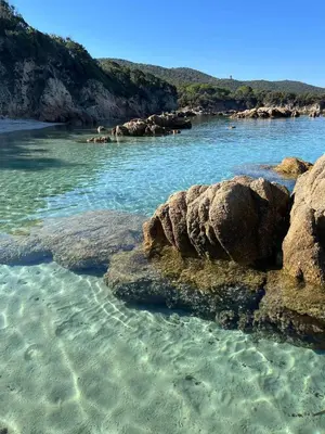 a body of water with rocks in the water at Le Francorsicat in Serra-di-Ferro