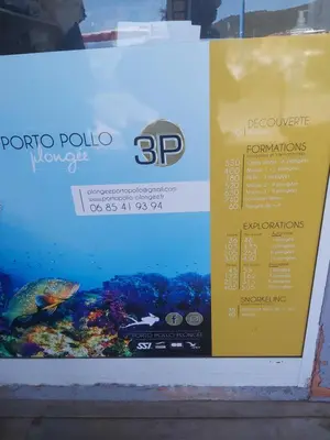 a sign in a window with a fish in it at Le Francorsicat in Serra-di-Ferro