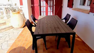 a bedroom with a bed with two towels on it at Appartement Kallisté, Logements avec vue citadelle de Bonifacio in Bonifacio