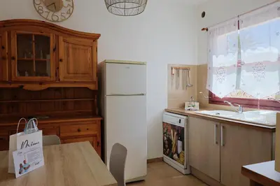 a bedroom with a bed with two towels on it at Appartement Kallisté, Logements avec vue citadelle de Bonifacio in Bonifacio
