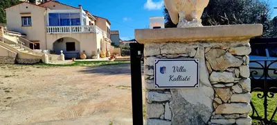 a kitchen with a sink and a counter top at Appartement Kallisté, Logements avec vue citadelle de Bonifacio in Bonifacio