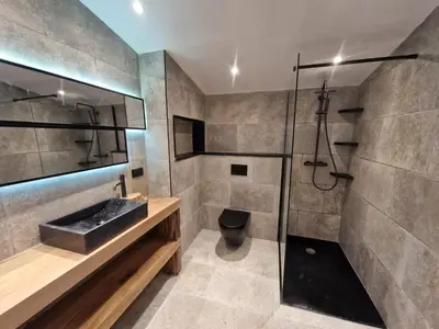 a bathroom with a sink and a shower at MAISON DE CARACTERE AVEC PISCINE in Sartène