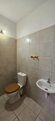 a bathroom with a toilet and a sink at T2 Paisible Quartier Vigna Majo, Olmeto in Olmeto