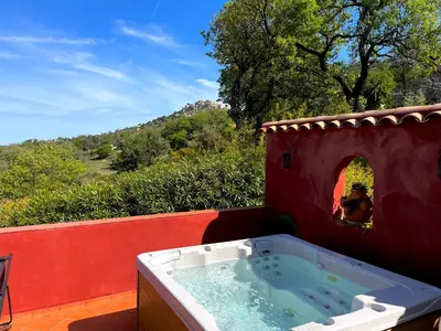 a hot tub in a play house with a person in the window at Domaine Victoria in SantʼAntonino