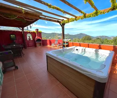 a jacuzzi tub on the roof of a house at Domaine Victoria in SantʼAntonino