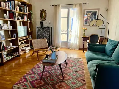 a living room with a couch and a coffee table at F3 de charme centre ville Ajaccio in Ajaccio