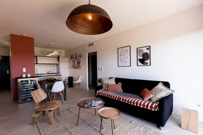 a living room with a couch and a table at Joséphine - Appt vue exceptionnelle Porto-Vecchio in Porto-Vecchio
